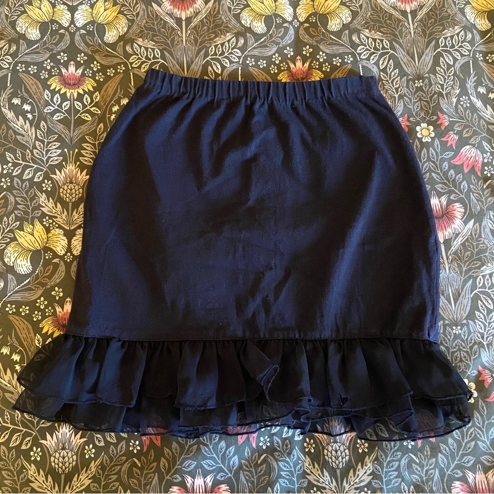 Black mini skirt with ruffles